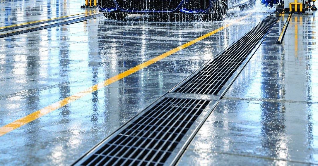 Drainage channels and floor markings in a completed wash bay